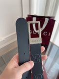 Close-up of a black Gucci premium leather belt with silver buckle.