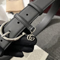 Premium black leather belt with silver buckle and GG charm