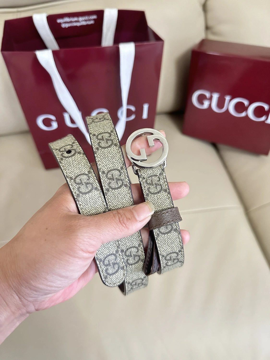 Gucci belt with GG logo buckle on beige background - Hình 8