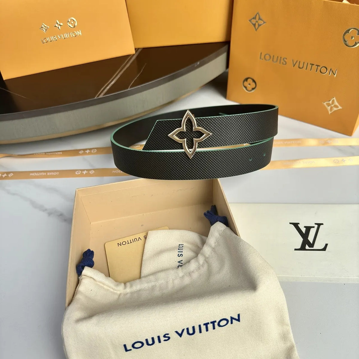 gold LV Black Textured Leather Belt