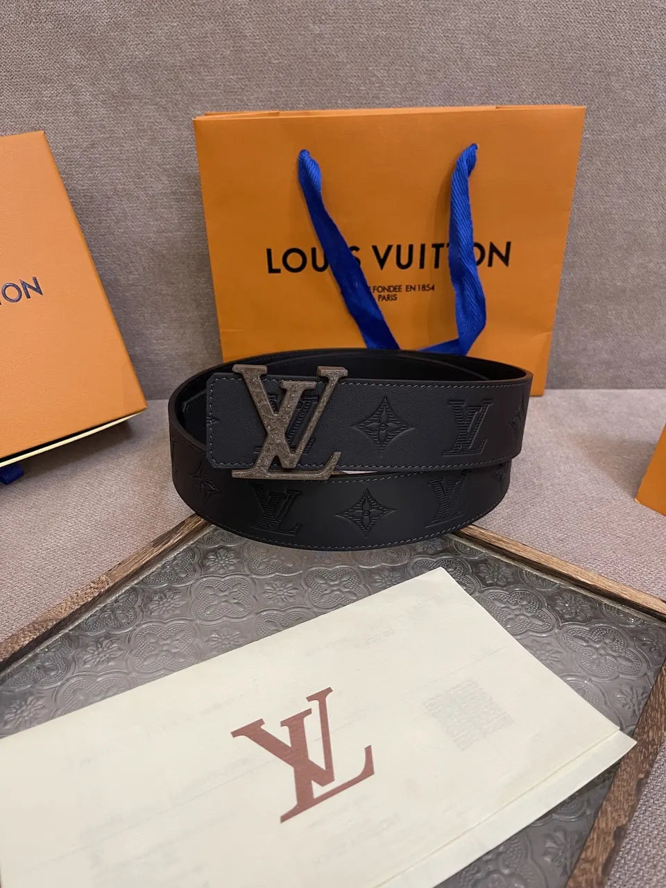 brown Louis Vuitton Embossed Black Leather Belt